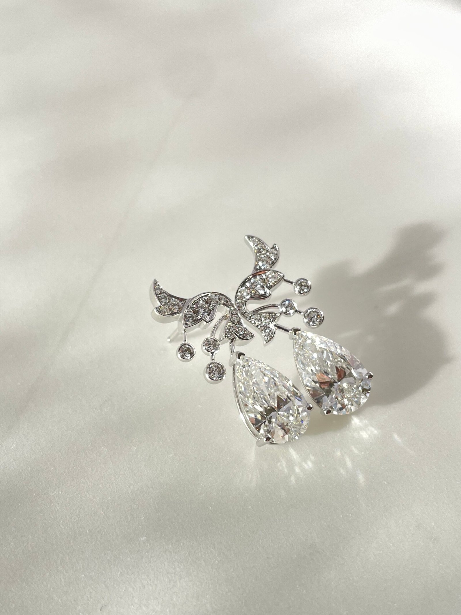 customizable diamond earrings are 18k gold pear shaped cut diamond earrings specially designed for women customizable diamond earrings are 18k gold pear shaped cut diamond earrings specially designed for women