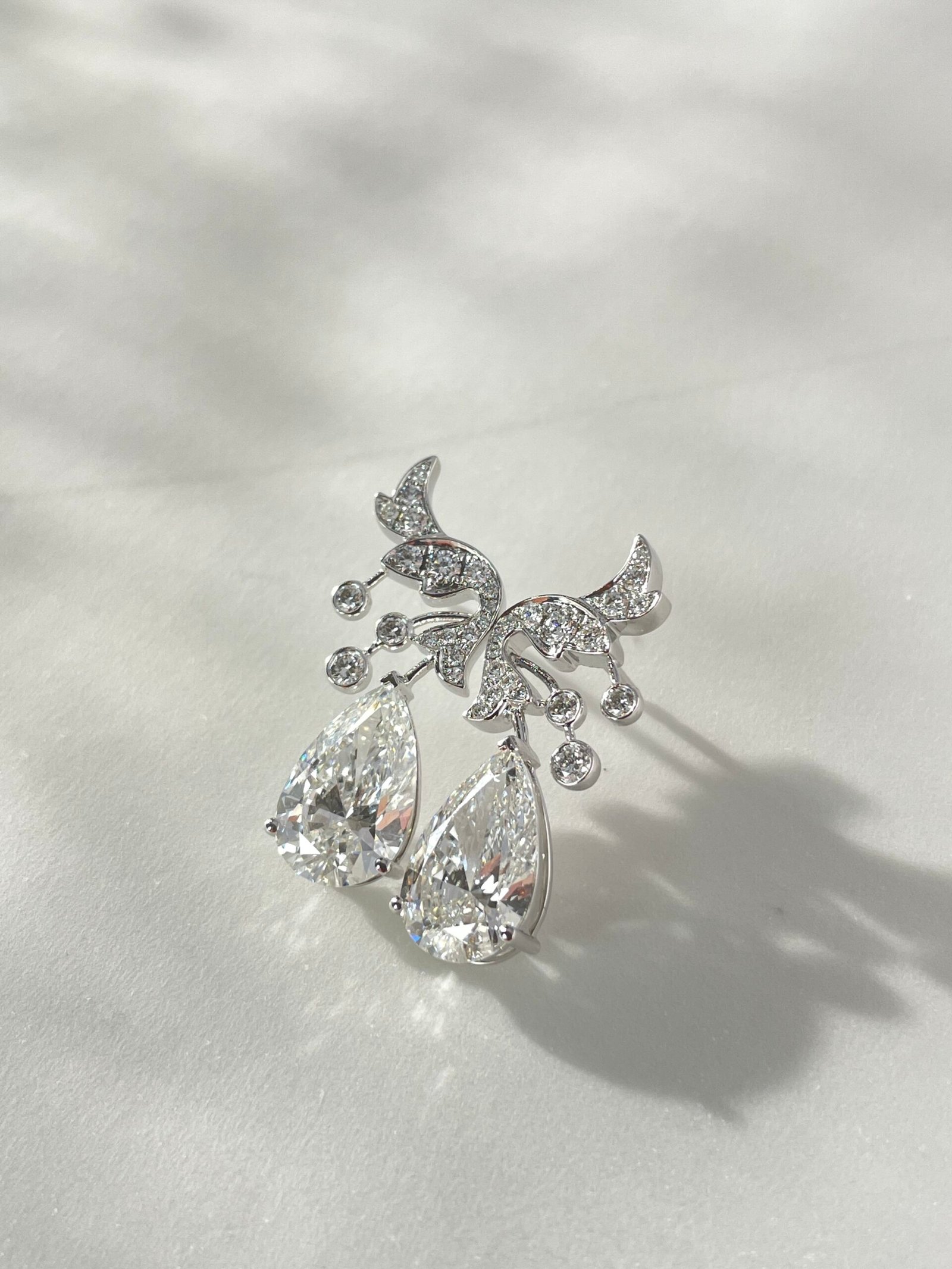 customizable diamond earrings are 18k gold pear shaped cut diamond earrings specially designed for women customizable diamond earrings are 18k gold pear shaped cut diamond earrings specially designed for women
